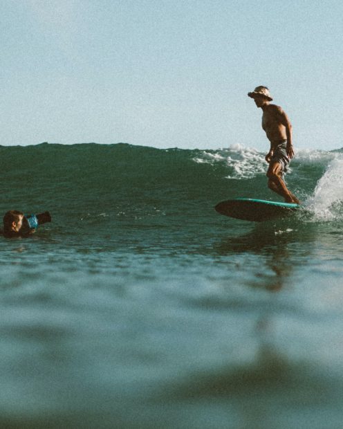 freelance photographer captures a surfer on the wave 