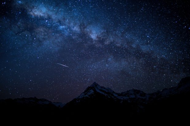 Photo of night sky over mountains