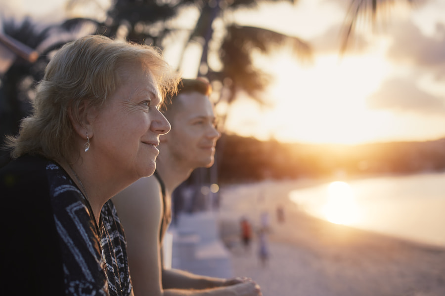 Senior woman with her adult son looking at beach by Jaromír Chalabala on 500px.com