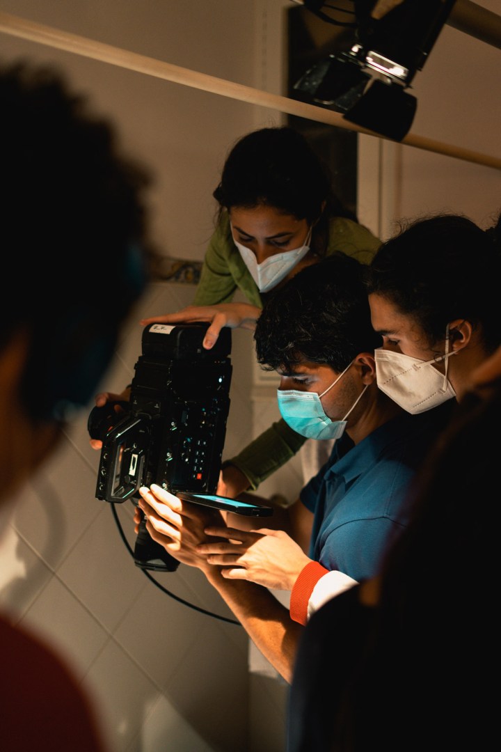 Behind the scenes with filmmakers using a professional camera for an overhead shot