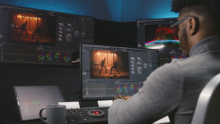 Film editor working on color grading in studio