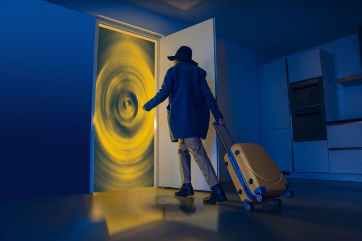 Woman with a suitcase entering a door to the future