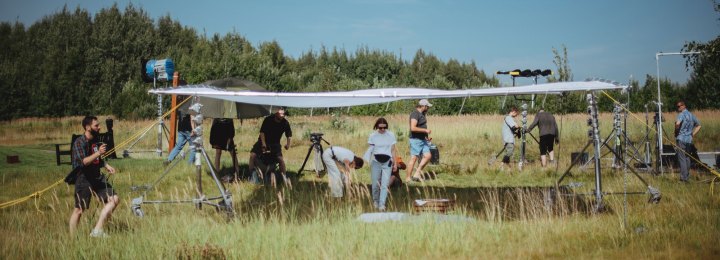 Outdoor film crew setting up a location